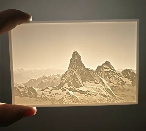 A printed lithophane of the Matterhorn, held up and lit from behind